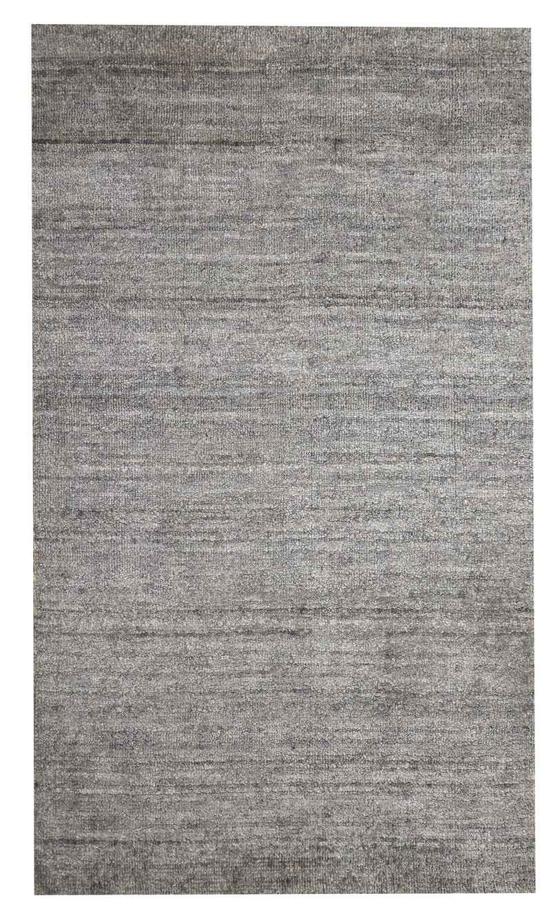 A textured, light gray area rug with a subtle woven pattern. The minimalist design conveys a modern, neutral tone suitable for varied interior decor.