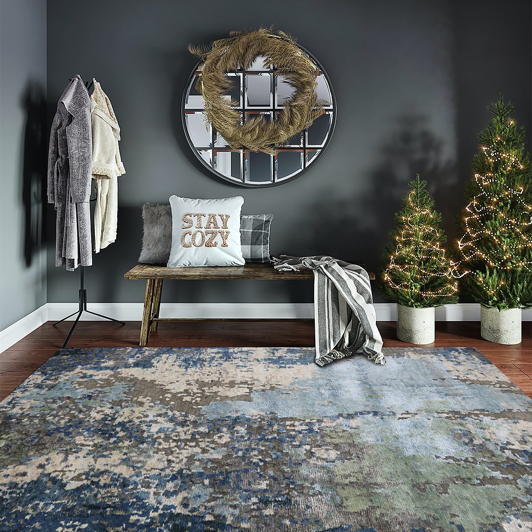 Handmade modern area rug in cozy living room with bench, pillows, and holiday decor.