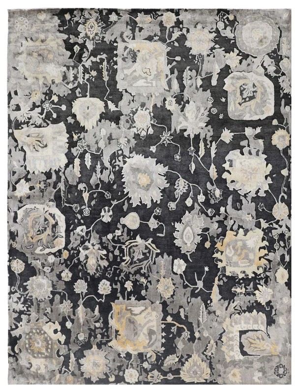 Handmade rug with a charcoal gray and cream abstract floral pattern