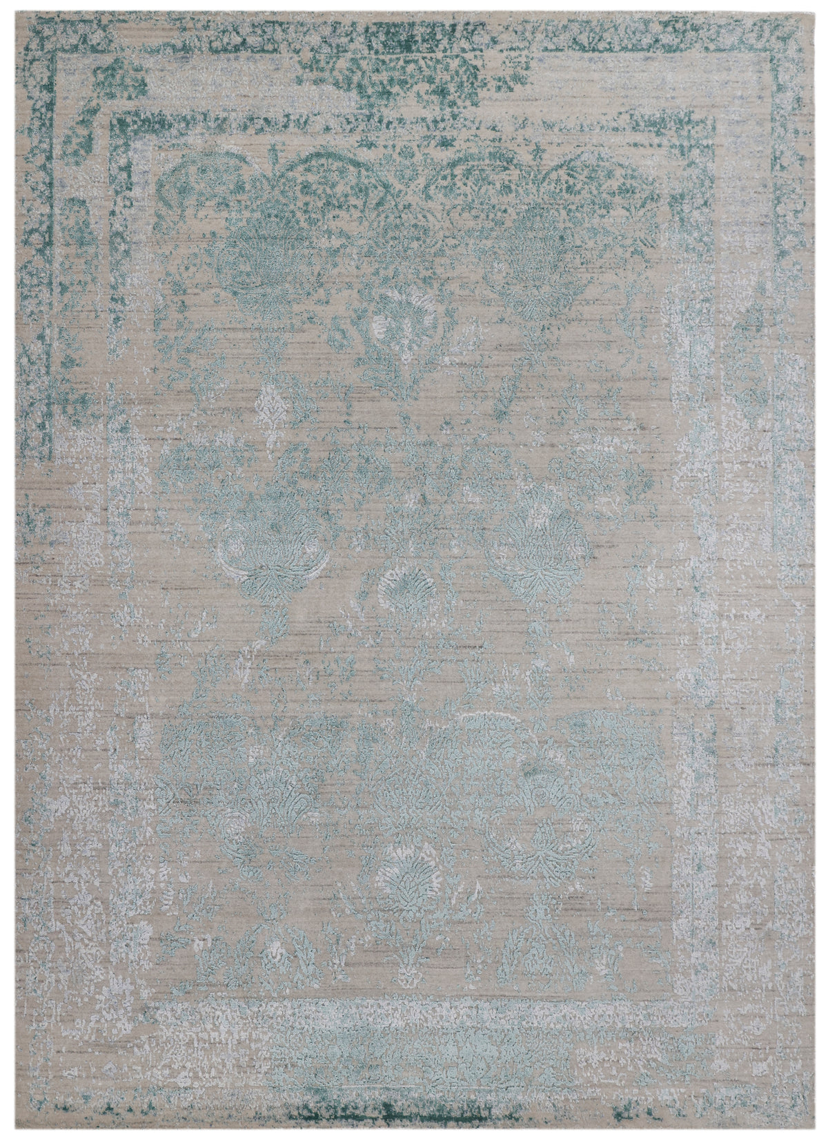 Vintage-style rug with a faded blue-green ornate pattern on a light beige background, conveying an antique, rustic charm.