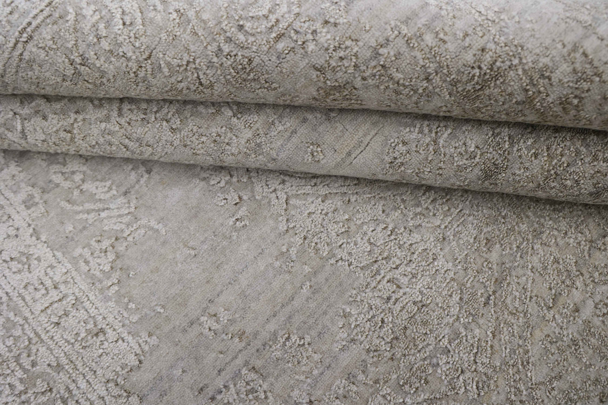 Close-up of a textured beige handmade carpet with an embossed pattern
