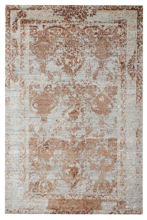 Distressed vintage-style rug with faded rust-brown floral medallions and ornate borders on a pale gray background, evoking a worn, antique feel.