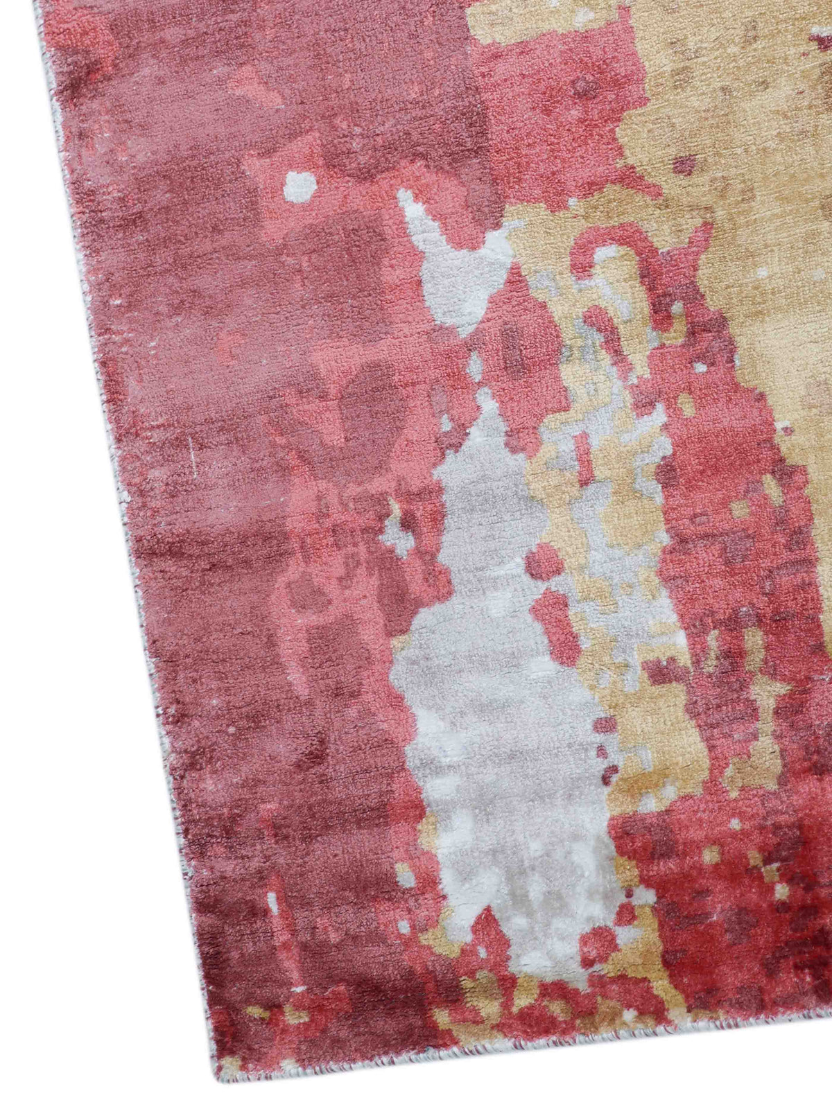 Abstract-patterned rug with a blend of burgundy, pink, beige, and white hues creating an artistic, textured design. It conveys a warm, modern aesthetic.
