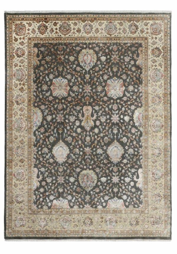 Ornate Persian rug with intricate floral patterns on a dark background, bordered by lighter shades. Rich details convey elegance and tradition.