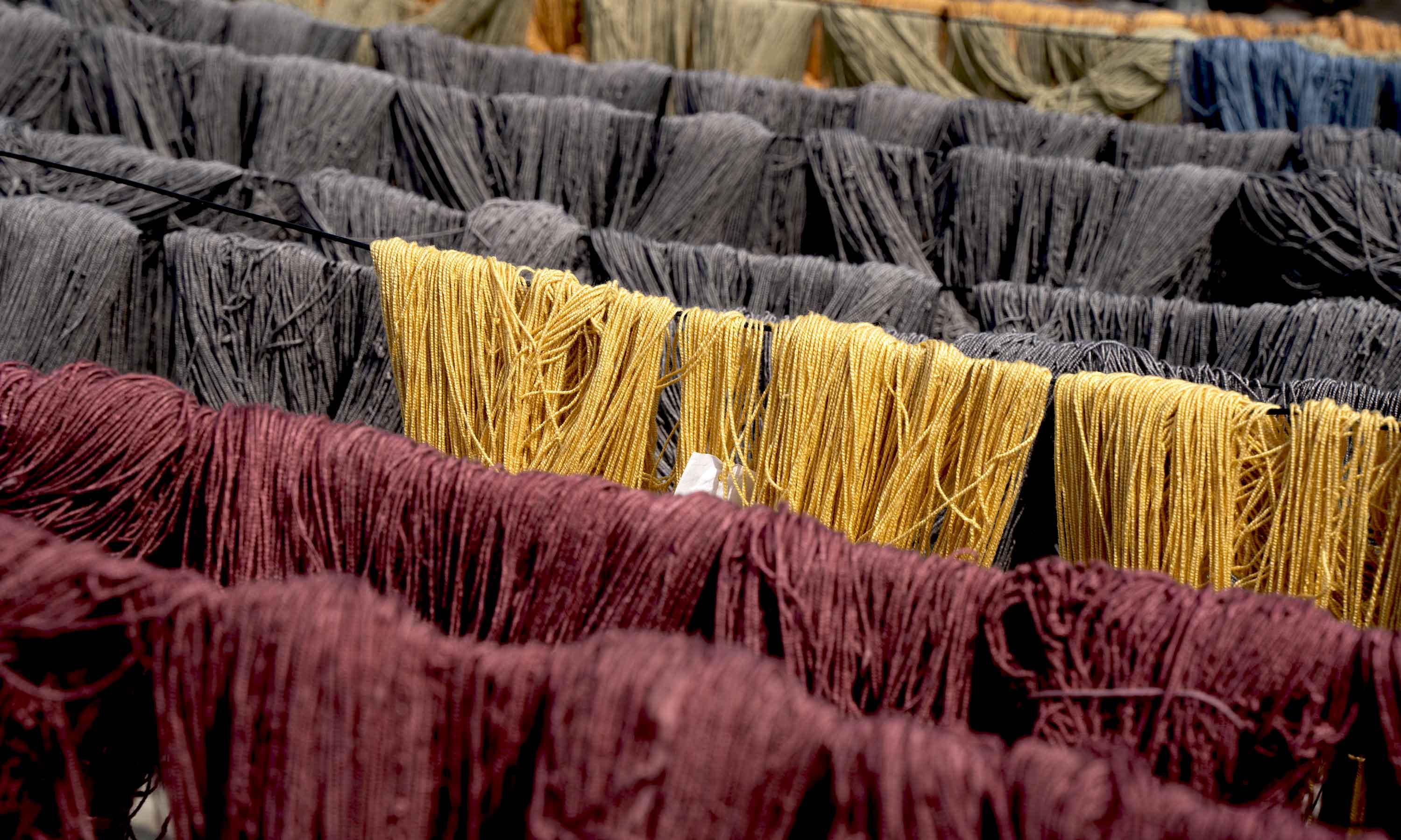Colorful yarn bundles drying, used for handmade carpets and rugs